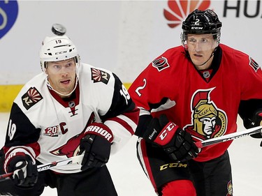 Shane Doan (L) and Dion Phaneuf look for the puck in the second period as the Ottawa Senators take on the Arizona Coyotes in NHL action at the Canadian Tire Centre.  photo by Wayne Cuddington/ Postmedia