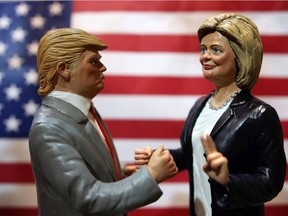Statuettes depicting the presidential candidates Donald Trump, left, and Hillary Clinton are displayed in a shop.
