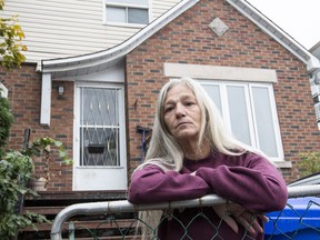 Suzie MacDonald in her Hull home that she claims was damaged when the city was working on water and sewer lines many years ago.