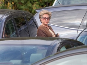 Tammy Peachy waits for a parking lot attendant to move a vehicle blocking her in at a parking lot behind the Civic Hospital this week. (Wayne Cuddington/ Ottawa Citizen)