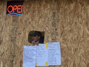 The CannaGreen marijuana dispensary sellis pot from a makeshift takeout window. City building inspectors are investigating whether the setuup violates the building code.