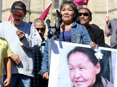 The family of Annie Pootoogook - an Inuit artist who was recently found dead in the Rideau River - tearfully address the crowd. Holding her picture is cousin, Kilatja Simeonie, as  Pootoogook's brother, Pauloosie Joanasie (left) looks on. Prime Minister Justin Trudeau, along with a number of his female cabinet ministers, made a surprise visit to a vigil for missing and murdered Indigenous women, girls and Two-Spirit people (MMIWG2S) Tuesday (Oct. 4, 2016) on Parliament Hill.