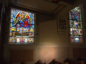 The memorial window (L) in St. Anthony's Church was created in the early 1950's by Guido Nincheri a well known artist from Montreal. It depicts the sacrifices of four soldiers in both World Wars. The Soldier's Guardian Angel is arrayed as a warrior of the Roman Legion, holding in his arms the body of Alfred Menchini who gave his life in WWI. The inscription below, set between the symbols of the three fields of the military, the Navy, Army and Air Force, lists the names of the 21 young men of the Parish who gave their lives for their country in WWII. The Union Jack, unfurled below his shoulder, is representative of the fact that the soldier died in the service of his country. The flag became the pall which covered his coffin as it was placed on the gun carriage, conveying him to his last resting place. The soldier is being offered to Christ the King of Kings. You will notice the names are not only Italian, but French, Irish, English, Polish reflecting the multi-nature of the Village.  photo by Wayne Cuddington/ Postmedia