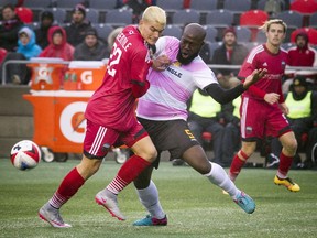 The Ottawa Fury's Giuseppe Gentile (92) battles the Fort Lauderdale Strikers' Nana Attakora for the ball during the game at TD Place Saturday, Oct. 29, 2016.