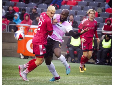 The Ottawa Fury's Giuseppe Gentile battles Fort Lauderdale's Nana Attakora for the ball.