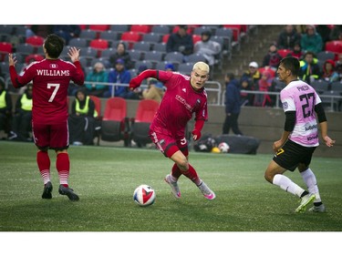 The Ottawa Fury's Giuseppe Gentile keeps running for the ball after a call.