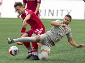 The Ottawa Fury FC Ryan Williams battles for the ball against Puerto Rico FC's Tyler Rudy at TD Place Sunday October 2, 2016.