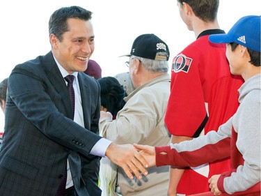 OTTAWA, ON - OCTOBER 12: Head Coach Guy Boucher of the Ottawa Senators arrives on the red carpet prior to the start of the home opener against the Toronto Maple Leafs at Canadian Tire Centre on October 12, 2016 in Ottawa, Ontario, Canada.