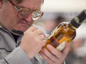 Mike Smith, a.k.a. 'Bubbles' signs autographs during a launch event for Trailer Park Boys Liquormen's Old Dirty Canadian Whisky at the LCBO store on Queen Quay in Toronto on October 6, 2016.