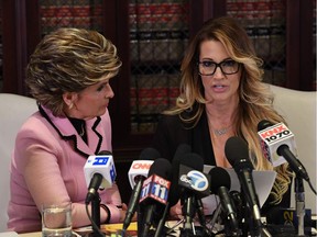 Jessica Drake (R), who works for an adult film company speaks beside attorney Gloria Allred (L) about allegations of sexual misconduct against Republican presidential hopeful Donald Trump during a press conference in Los Angeles, California on October 22, 2016.