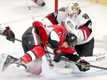 Zack Smith crashes into goalie Mike Smith in the second period as the Ottawa Senators take on the Arizona Coyotes in NHL action at the Canadian Tire Centre.  photo by Wayne Cuddington/ Postmedia