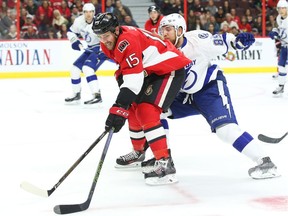 Zack Smith of the Ottawa Senators is hooked by Nikita Nesterov of the Tampa Bay Lightning during the first period at Canadian Tire Centre on Saturday, Oct. 22, 2016.