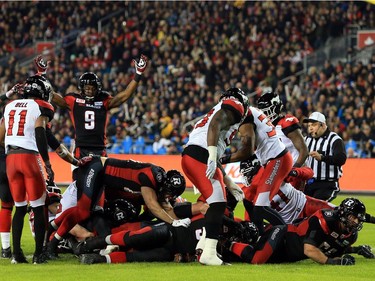 TORONTO, ON - NOVEMBER 27:  Quarterback Henry Burris #1 of the Ottawa Redblacks scores a touchdown during the first half of the 104th Grey Cup Championship Game against the Calgary Stampeders at BMO Field on November 27, 2016 in Toronto, Canada.