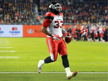 TORONTO, ON - NOVEMBER 27:  Jerome Messam #33 of the Calgary Stampeders runs in a touchdown during the first half of the 104th Grey Cup Championship Game against the Ottawa Redblacks at BMO Field on November 27, 2016 in Toronto, Canada.