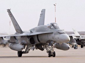 A pilot positions a CF-18 Hornet at the CFB Cold Lake, in Cold Lake, Alberta on Tuesday, October 21, 2014. The Canadian Forces says a CF-18 fighter jet has crashed in northeastern Alberta.A military spokesman said the plane was based out of Canadian Forces Base Cold Lake. THE CANADIAN PRESS/Jason Franson ORG XMIT: CPT126