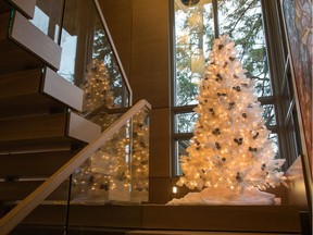 A white Christmas tree sits on the stairs of this Mayfair home.