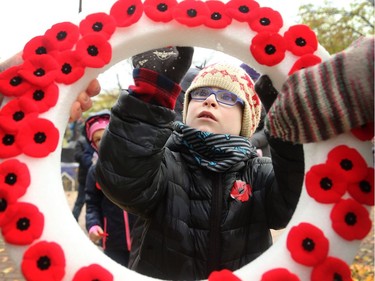 About 270 kids from Regina Public School and Dr. F.J. MacDonald Catholic School walked to Remembrance Day ceremonies at the Flanders Field Mosaic Memorial at Britannia Park Friday (Nov. 11, 2016) morning.  Parents, teachers and community members joined the kids, who read poems, sang songs and placed their poppies on wreaths after the service.