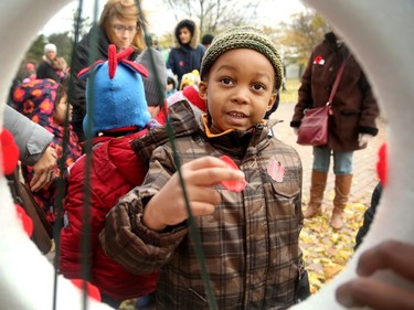 About 270 kids from Regina Public School and Dr. F.J. MacDonald Catholic School walked to Remembrance Day ceremonies at the Flanders Field Mosaic Memorial at Britannia Park Friday (Nov. 11, 2016) morning.  Parents, teachers and community members joined the kids, who read poems, sang songs and placed their poppies on wreaths after the service.