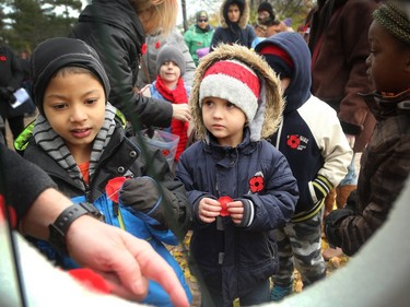 About 270 kids from Regina Public School and Dr. F.J. MacDonald Catholic School walked to Remembrance Day ceremonies at the Flanders Field Mosaic Memorial at Britannia Park Friday (Nov. 11, 2016) morning.  Parents, teachers and community members joined the kids, who read poems, sang songs and placed their poppies on wreaths after the service.