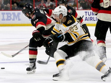 Boston's Brad Marchand gets the puck taken away by Ottawa's Tom Pyatt during third-period action of the Ottawa Senators matchup against the Boston Bruins Thursday (Nov.4, 2016) at Canadian Tire Centre in Ottawa.