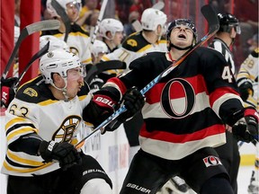 Boston's Brad Marchand hits Ottawa's  Jean-Gabriel Pageau in the neck with his stick during first-period action of the Ottawa Senators matchup against the Boston Bruins Thursday (Nov.4, 2016) at Canadian Tire Centre in Ottawa.