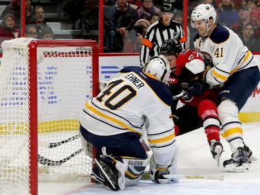 Buffalo's Justin Falk (right) keeps the puck away from Curtis Lazar in a close call in front of Buffalo's net during first-period action between the Ottawa Senators and the Buffalo Sabres Tuesday (Nov. 29, 2016) at the Canadian Tire Centre in Ottawa. Julie Oliver/Postmedia