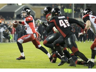 Calgary Stampeders quarterback Andrew Buckley (15) runs the ball against the Ottawa Redblacks during fourth quarter CFL Grey Cup action Sunday, November 27, 2016 in Toronto.