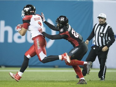 Calgary Stampeders wide receiver Lemar Durant (1) runs in for a touchdown as Ottawa Redblacks defensive back Forrest Hightower (23) defends during third quarter CFL Grey Cup action Sunday, November 27, 2016 in Toronto.
