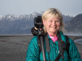 Carleton journalism professor Kanina Holmes stands on the shores of Kluane Lake, Yukon Territory, during a trip in June 2016. Photo courtesy of Dave Brosha.