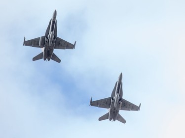 CF 18's flyover as families, veterans, and military personnel attend Remembrance Day ceremonies at Beechwood Cemetery.