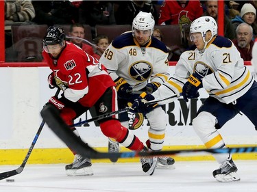 Chris Kelly takes the puck away from Buffalo during second-period action between the Ottawa Senators and the Buffalo Sabres Tuesday (Nov. 29, 2016) at the Canadian Tire Centre in Ottawa.
