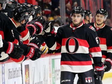 Chris Wideman gets fist pumps from his teammates for his first goal of the season during third-period action of the Ottawa Senators matchup against the Boston Bruins Thursday (Nov.4, 2016) at Canadian Tire Centre in Ottawa
