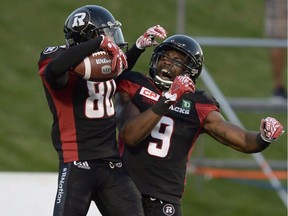 Ottawa Redblacks' Chris Williams (80) celebrates with Ernest Jackson (9) after his touchdown against the Montreal Alouettes during first half CFL action on Friday, Aug. 19, 2016 in Ottawa. Five years ago Jackson was playing in the Ultimate Indoor Football League. Now the dangerous receiver is the East Division nominee for Most Outstanding Player in the CFL.