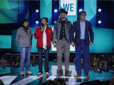 Daisy Munroe (from left), Pearl Achneepineskum, Gord Downie and Mike Downie address the crowd at WE Day Ottawa at the Canadian Tire Centre, Wednesday, November 9, 2016.