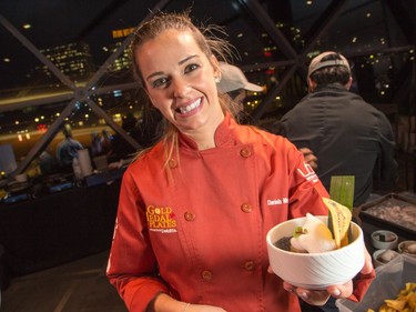 Daniela Manrique of The Soca Kitchen with her plate of Pig Ear Crusted Tuna as ten Ottawa area chefs compete in the annual Gold Medal Plates competition and fund raiser for the Canadian Olympic Organization.   Wayne Cuddington/ Postmedia