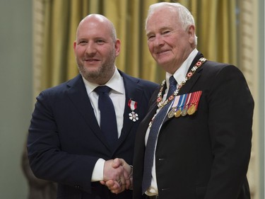 Governor General David Johnston invests Dani Reiss, of Toronto, as a Member of the Order of Canada during a ceremony at Rideau Hall in Ottawa, Thursday, November 17, 2016.