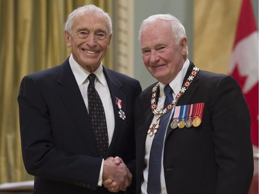Governor General David Johnston invests Geoffrey Battersby, of Revelstoke, B.C., as a Member of the Order of Canada during a ceremony at Rideau Hall in Ottawa, Thursday, November 17, 2016.