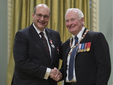 Governor General David Johnston invests Jack Mintz, of Calgary, as a Member of the Order of Canada during a ceremony at Rideau Hall in Ottawa, Thursday, November 17, 2016.