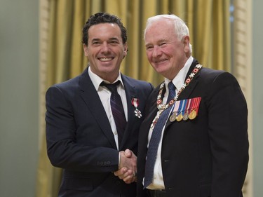 Governor General David Johnston invests Joseph Boyden as a Member of the Order of Canada during a ceremony at Rideau Hall in Ottawa, Thursday, November 17, 2016.
