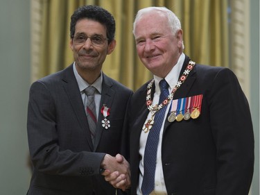 Governor General David Johnston invests Rohinton Mistry, of Toronto, as a Member of the Order of Canada during a ceremony at Rideau Hall in Ottawa, Thursday, November 17, 2016.