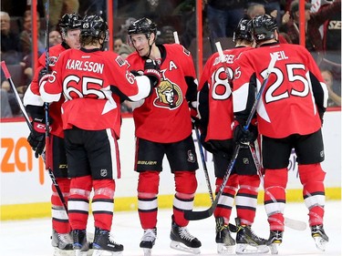Dion Phaneuf (far left) celebrates his goal with Kyle Turris (centre), Erik Karlsson (65) and other teammates, but after a coach's challenge it was disallowed during second-period action between the Ottawa Senators and the Buffalo Sabres Tuesday (Nov. 29, 2016) at the Canadian Tire Centre in Ottawa.