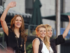 In this May 26, 2006, file photo, Dixie Chicks, from left, Emily Robison, Natalie Maines and Martie Maguire, wave to the crowd as they perform on ABC's "Good Morning America" summer concert series in Bryant Park, in New York.