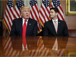 President-elect Donald Trump and House Speaker Paul Ryan of Wis., pose for photographers after a meeting in the Speaker's office on Capitol Hill in Washington, Thursday, Nov. 10, 2016.