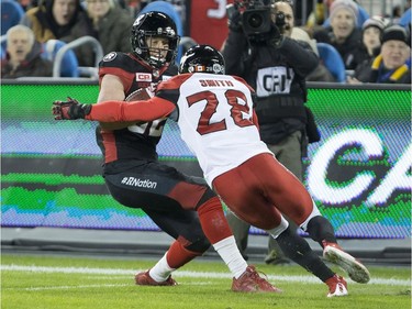 Ottawa Redblacks wide receiver Greg Ellingson is tackled by Calgary Stampeders defensive back Brandon Smith during first quarter CFL Grey Cup action, Sunday, November 27, 2016 in Toronto.
