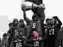 Ottawa Redblacks Ernest Jackson holds the Grey Cup during a parade celebrating the team's victory over the Calgary Stampeders, Tuesday, Nov. 29, 2016 in Ottawa.