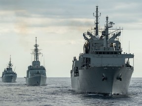 Her Majesty’s Canadian Ship (HMCS) MONTREAL (left) and HMCS ATHABASKAN (center) prepare for a sail past to bid farewell to the Spanish tanker ship ESPN PATINO (right) during SPARTAN WARRIOR 16 in the Atlantic Ocean on November 3, 2016.  Photo: MCpl Jennifer Kusche, Canadian Forces Combat Camera  IS15-2016-0003-088