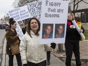 Family and supporters of homicide victim Fouad Nayel, including his mother Nicole (white jacket), protested outside of the Ottawa Courthouse on Thursday November 17, 2016.