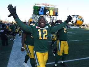 Edmonton Eskimos linebacker Alex Ogbongbemiga (12) celebrates his team's victory over the Hamilton Tiger-Cats in the dying seconds of the second-half of CFL eastern semi-final football action, in Hamilton, Ont., on Sunday, November 13, 2016.