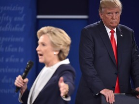 Donald Trump listens to Hillary Clinton during the second presidential debate at Washington University on Oct. 9. Many felt he was stalking her on stage.