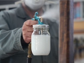 This small, inexpensive sprayer does an excellent job applying urethane to wood. Finishing liquids are held in a standard mason jar that threads into the gun.